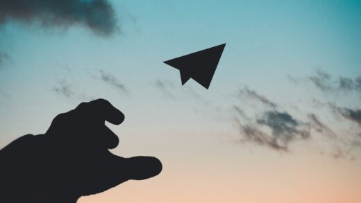 Silhouette Photo of Man Throw Paper Plane